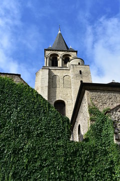 Church of Saint Germain des Pres. Bell tower with ivy and blue sky from the Boulevard Saint Germain. Paris, France.