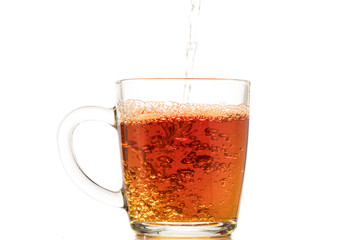 making black tea from a bag with sugar in motion on a white background