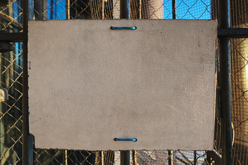 Plate on metal fence Readable spaces Copy space