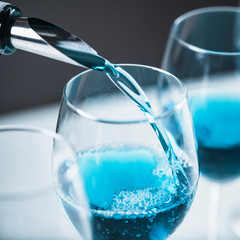 Blue Wine Pouring
