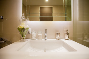 Ceramic shampoo, soap bottle and towels  in bathroom white bathroom