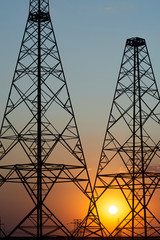sunset on the background of power lines