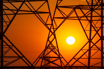 sunset on the background of power lines