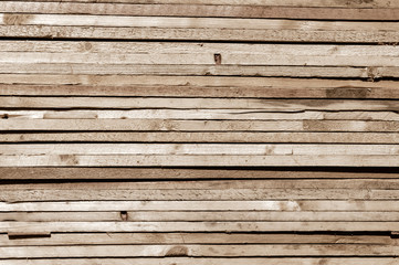 Obraz premium Stack of many Obsolete plywood hardwood plank timber stacked in a row. Abstract texture background. Copy Space