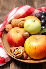 Obraz na płótnie Canvas apple, nut and grapes- autumn fruit