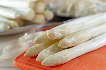 New harvest of white asparagus, high quality peeled and washed raw asparagus in spring season, ready to cook