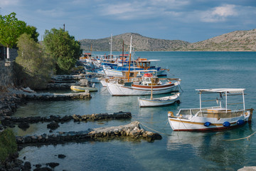 Traditional boats in the harbor of Elounda