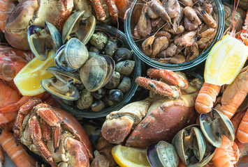 Various of sea foods close up. Shrimps, lobsters, lemon