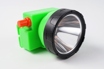 Green led headlamp for fixing on head on white background