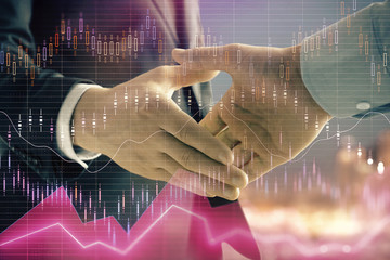 Double exposure of financial chart on cityscape background with two businessmen handshake. Concept of financial analysis and investment opportunities