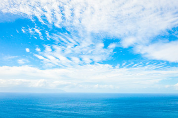 Fototapeta na wymiar Aerial View of the Blue and Turquoise Sea and Cloudy Sky - Image
