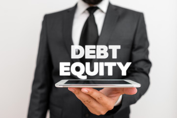 Obraz premium Writing note showing Debt Equity. Business concept for dividing companys total liabilities by its stockholders