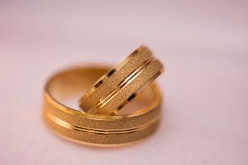 Macro shot of two gold wedding rings 