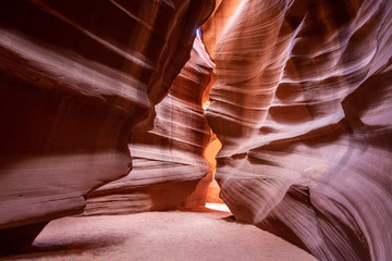 Wide angle view of the interior of the Upper Antelope Canyon, with red sandstone walls carved by the elements