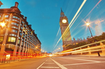 Big Ben, one of the most prominent symbols of both London and England, as shown at night along with the lights of the cars passing by  © Iliya Mitsk