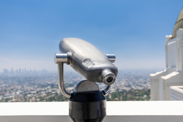 Close up of steel coin-operated binocular overlooking the city of Los Angeles