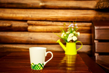 Coffee cup on wooden table background