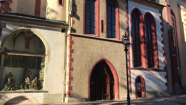 Tourist attraction in Banska Bystrica, Slovakia - Church of the Assumption of the Blessed Virgin Mary. Old gothic church. Exterior in sunny day. Parish church.