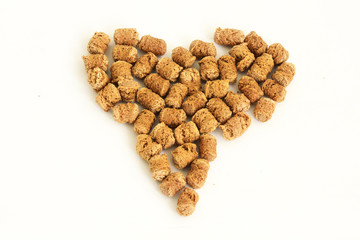 heart shaped wheat  bran on white background