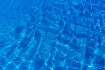 Clear blue water in swimming pool