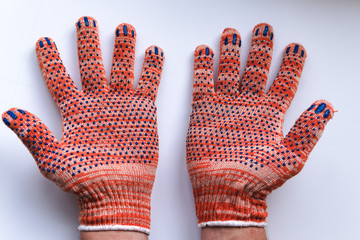 New construction gloves. knitted textile gloves on a white background. Protective equipment, safety...