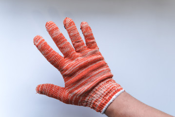 New construction gloves. knitted textile gloves on a white background. Protective equipment, safety...