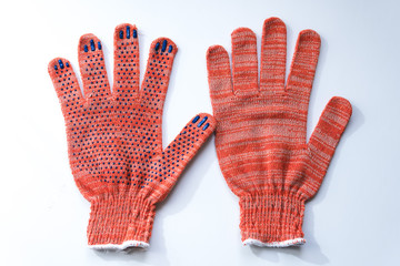New construction gloves. knitted textile gloves on a white background. Protective equipment, safety...