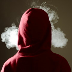 Young male in red hoodie vaping smoking, exhales thick vapor, isolated rear view