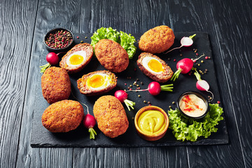 tasty meatballs stuffed with boiled eggs, top view