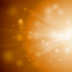 Gold sparkle rays with bokeh abstract elegant background. Dust sparks background.