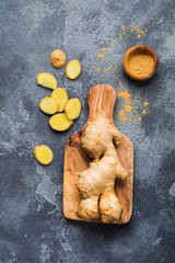 Ginger root on dark grey background. Top view.