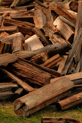 Fototapeta na wymiar A pile of old wood from house building. Wood recycling. Eco environment concept.