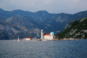 Fototapeta premium Gospa od Skrpjela, Island of Our Lady of the Rocks, Perast, Kotor Bay, Montegro