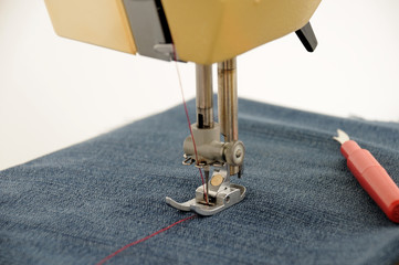 the sewing machine is prepared for the process of sewing clothes