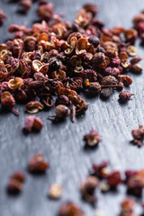 Obraz premium Sichuan peppercorns on black background