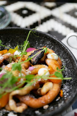 Fancy funnel cake with goat cheese, powdered sugar, edible flowers, and honey, top view, modern brunch