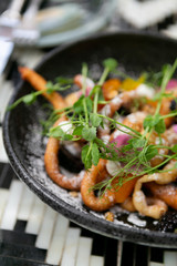 Fancy funnel cake with goat cheese, powdered sugar, edible flowers, and honey, top view, modern brunch