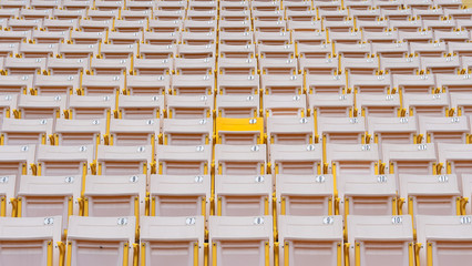 Stadium seat rows in sports arena for football or soccer game, public theatre, concert hall amphitheater with white yellow empty audience chair for outdoor sporty recreational background  outdoor