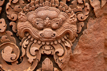Carved details from Angkor Wat, snakes, dragons, closeup