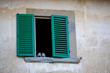Fototapeta na wymiar The shoes and the old window