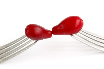 Cornelian Cherry (Cornus mas) on fork isolated on white background