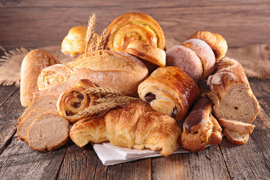 assorted of pastry- croissant, chocolate pastry and bread