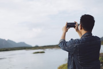 Obraz premium man take a picture by smart phone.