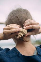 Fototapeta premium girl with a shell. nature conservation concept
