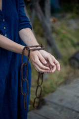 female hands in chains. Women's Inequality Concept
