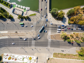 Aerial view to city crossroads with cars