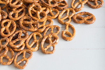 Close up mini Pretzels on white table. German party snack. 