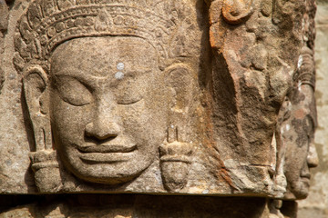 Closeup of faces carved in relief, Angkor Wat, Cambodia