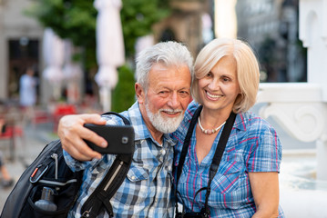 Senior couple taking selfie