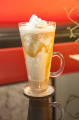 Tall glass of iced drink.